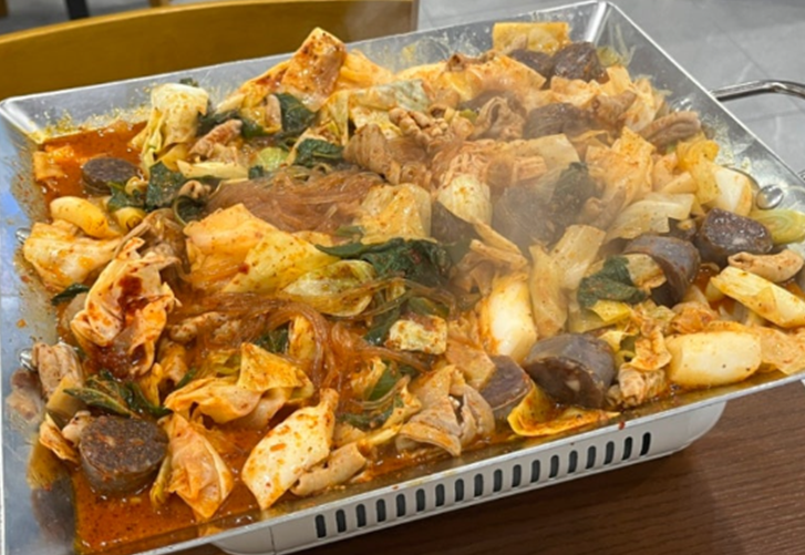 Spicy sundae bokkeum is stir-fried with vegetables and a spicy red sauce.