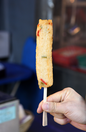 A Korean eomuk bar is served on a stick, making it a convenient snack to enjoy while walking around a market or shopping street.