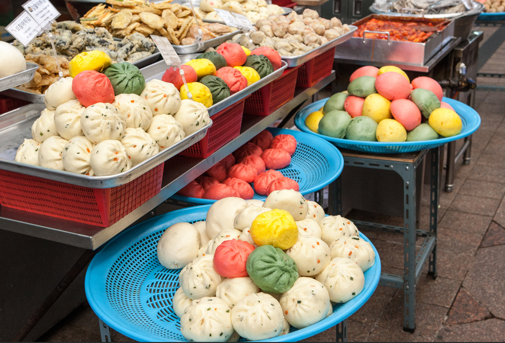 Steamed buns in various colors and flavors are displayed for sale at Sinpo Market in Incheon, South Korea.
