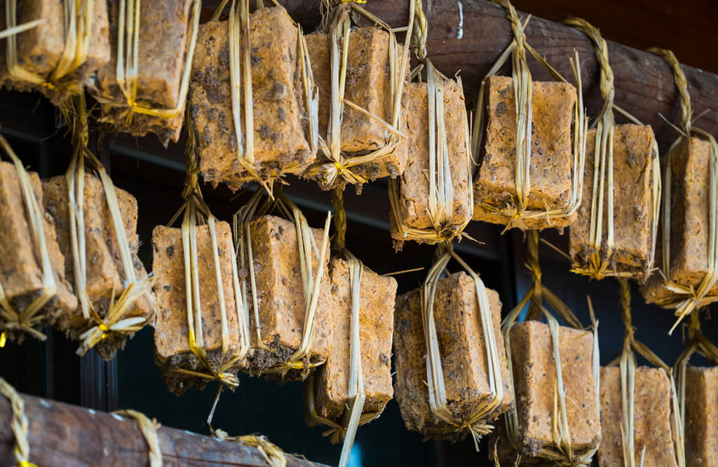 Korean Doenjang (된장): Fermented Soybean Paste Meju (메주), fermented soybean blocks tied with straw and hung to dry before being used to make doenjang and ganjang.